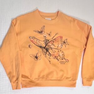AMERICAN EAGLE SKELETON BUTTERFLY CREWNECK - Orange and women’s size XS